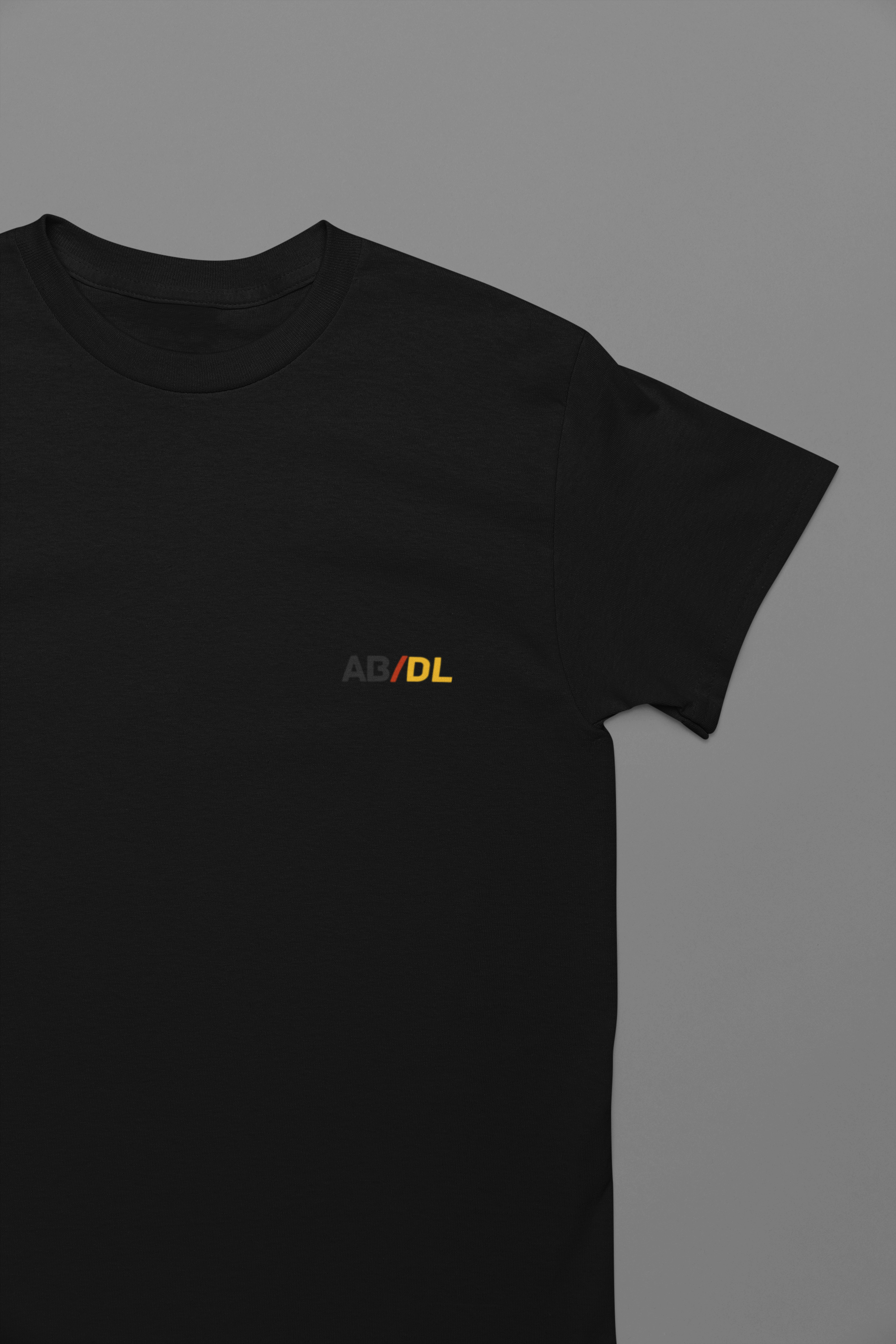 Black AB/DL tee with minimal graphic design for age regression and diaper lover community